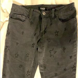 Distressed black skinny jeans